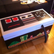 Illustration for article titled This Coffee Table Is A Giant Working Nintendo Controller